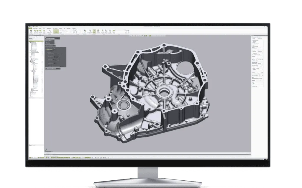 Desktop monitor showing CAD software with a 3D model of an engine block