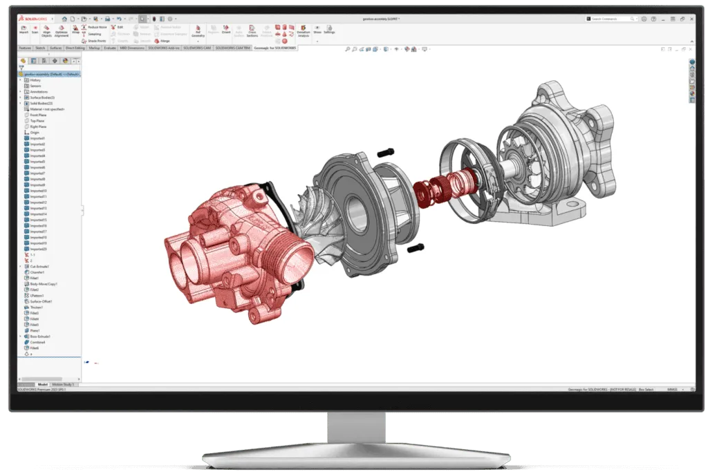 Desktop monitor showing an exploded CAD assembly of a turbocharger