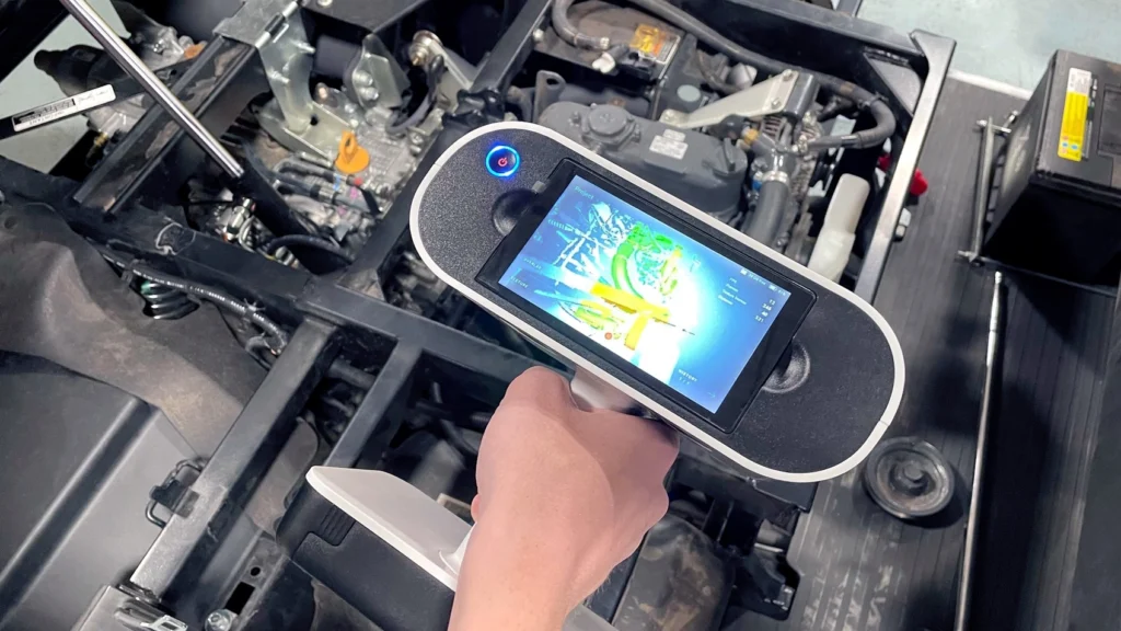 3D scanning the engine compartment of a Kubota utility vehicle with Artec Leo. Image courtesy of Curtis Cabs