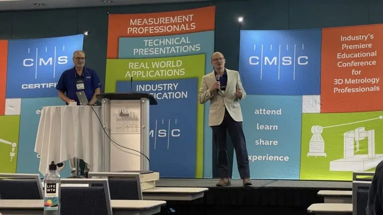 Speakers on stage at the CMSC conference for 3D metrology professionals