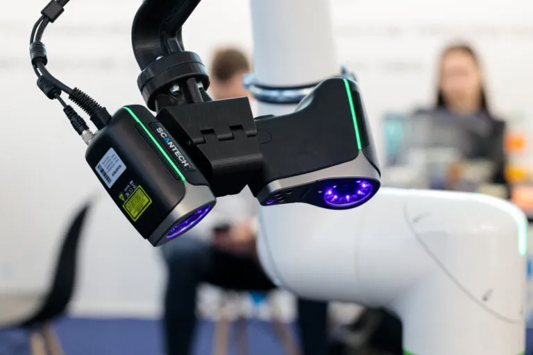 SCANTECH 3D scanner mounted on a collaborative robot arm for automated inspection