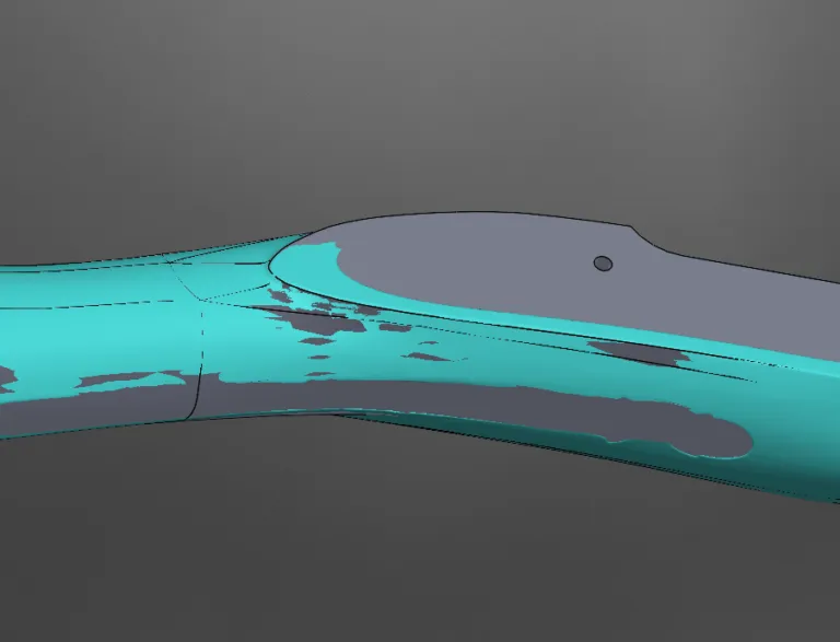 Scan data overlaid on the CAD model of a curved freeform part