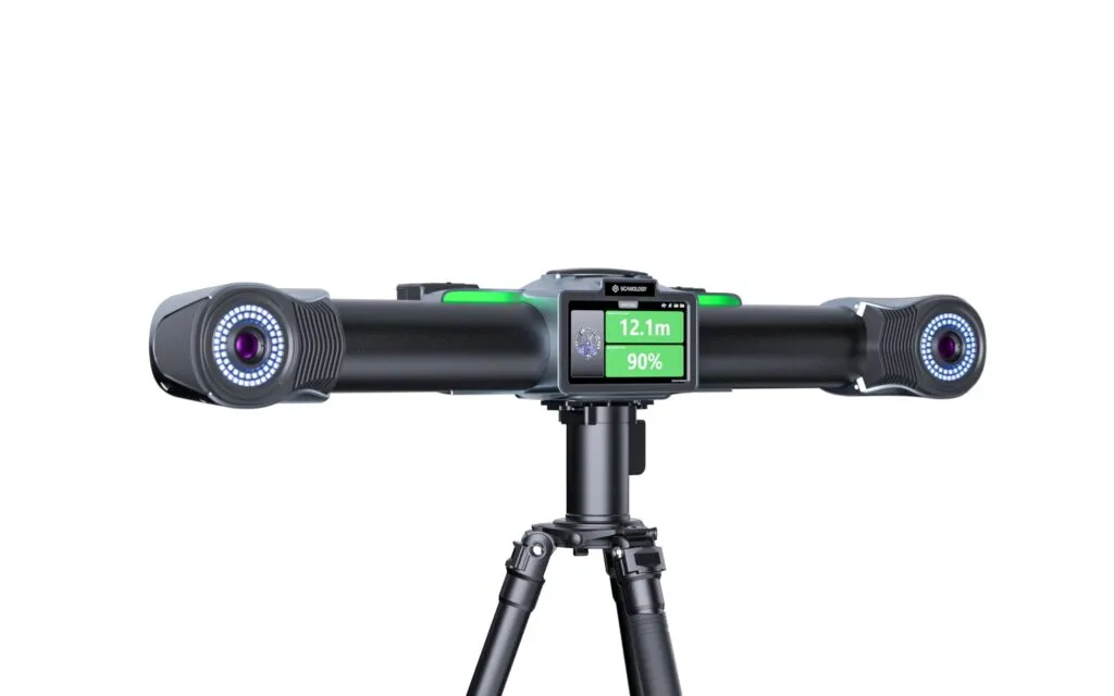 Close-up of the TrackScan Sharp-Z tracker head showing the built-in color display reporting 12.1 m range and 90 percent signal